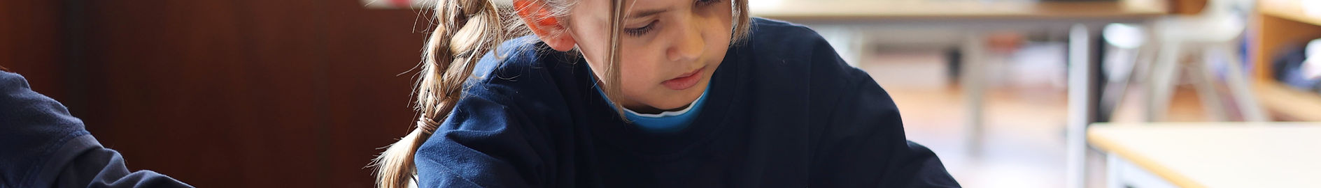 Preschool student concentrating on her schoolwork