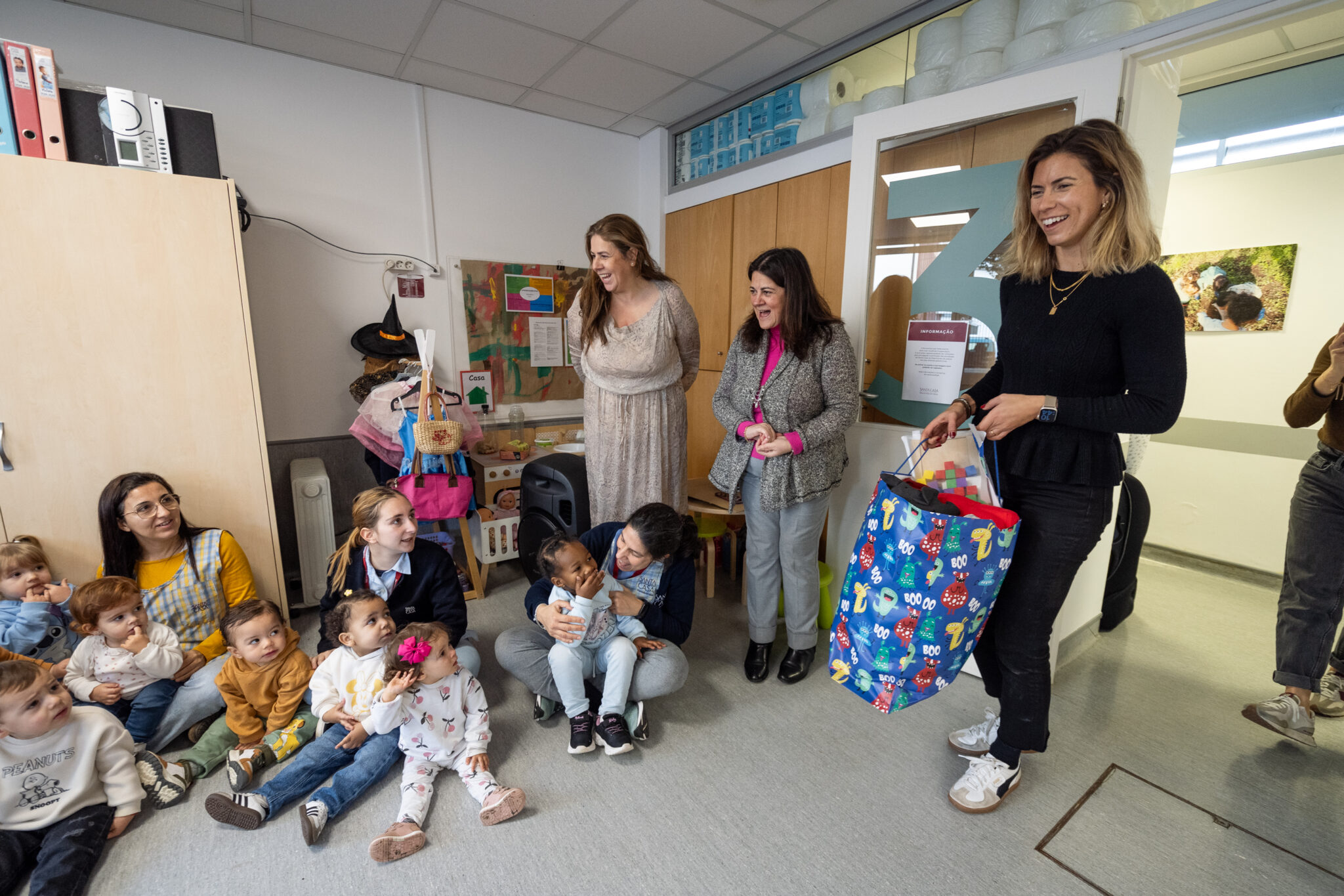 Preschool children and teachers gathered for an activity