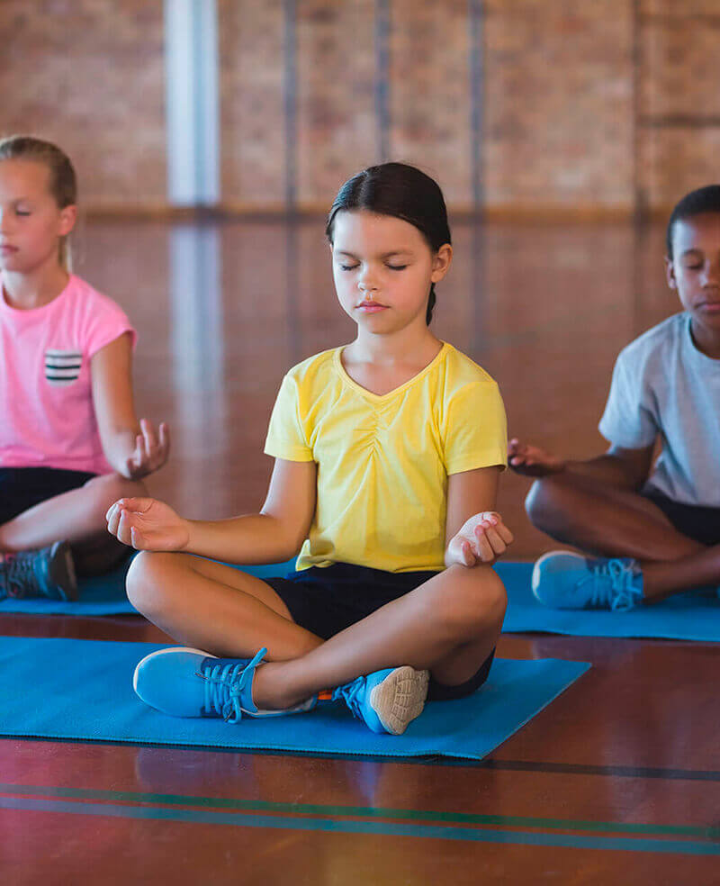 Preschool children practicing yoga and mindfulness