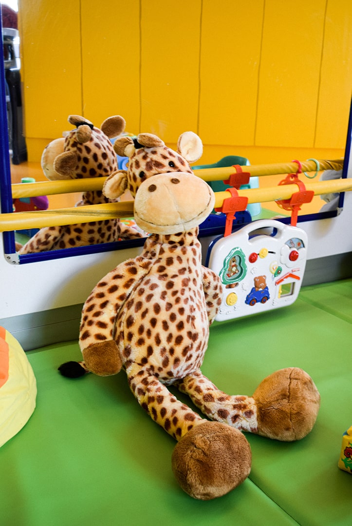 stuffed giraffe toy in a preschool classroom